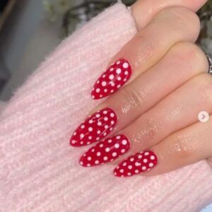 Red and White dotty nail extensions at Altrincham salon